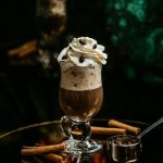 coffee-topped-with-whipped-cream-coffee-seeds_140725-1121